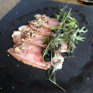 Wood plank-smoked duck, cherries, maple dressing, red mizuna and pecans